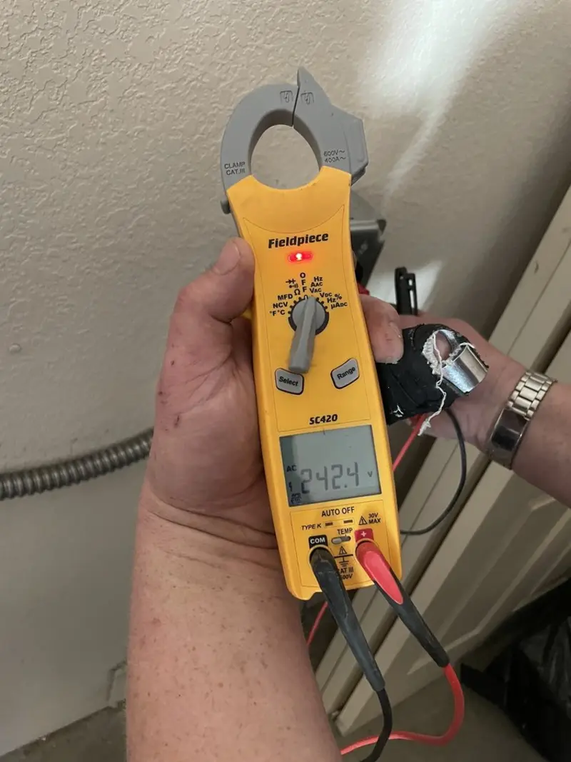 Voltage testing with clamp meter during Outlet Installation in Pine Castle